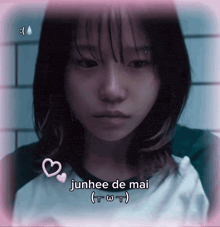 a picture of a girl with the words junhee de mai written on it