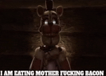a creepy teddy bear with chains around its neck is eating bacon .