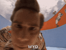 a close up of a person 's face with the word wyd visible