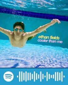 a man is swimming underwater in a pool with the words ethan fields cooler than me