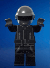a lego figure is wearing a helmet and a black outfit