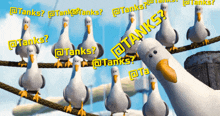 a group of seagulls are standing on a rope with the word tanks written in yellow letters