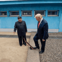 donald trump and kim jong un are standing next to each other on a skateboard