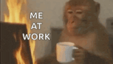 a monkey is holding a cup of coffee and sitting in front of a fire .