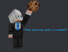 a minecraft character in a suit holds up a cookie