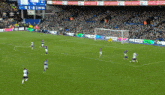 a soccer game is being played with the score 1-3