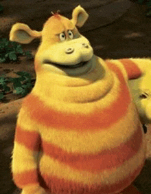 a close up of a cartoon character wearing a yellow and orange striped sweater .