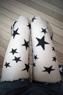 a woman with black stars on her legs