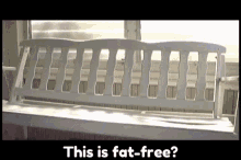 a white bench with the words " this is fat-free " on it