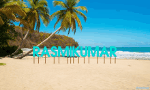 a beach with palm trees and the name rashkumar on the sand