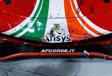 a red white and green ferrari with ansys written on the front