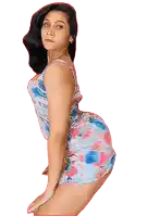 a woman in a floral dress is posing for a photo