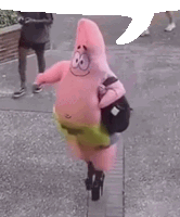 a person dressed as patrick star from spongebob squarepants is riding a scooter on a sidewalk .