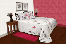 a bed with a quilt and pillows that say love on it