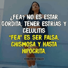 a woman is standing in front of a wall with a caption in spanish that says " fea no es estar gordita "