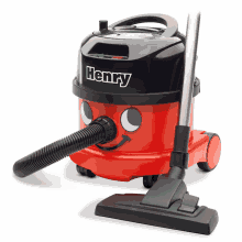 a red henry vacuum cleaner with a black top