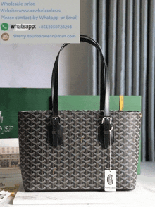 a goyard tote bag with a tag that says ' wholesale price '