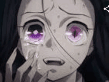 a close up of a person 's face with purple eyes and tears coming out of their eyes .