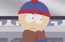 stanley from south park is wearing a blue hat and a scarf around his neck .