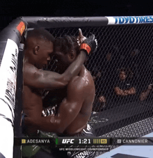 a ufc fight between adesanya and cannonier is shown on the screen