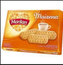 a box of marilan maizena cookies with a cup of coffee on the side .