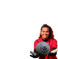 a woman in a red shirt is holding a soccer ball in her hands