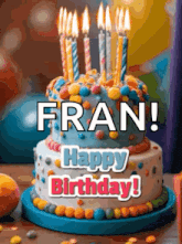 a birthday cake with candles on it is on a table and says fran ! happy birthday !