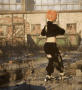 a woman with red hair is walking in front of a building