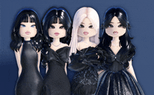 a group of dolls are standing next to each other in black dresses