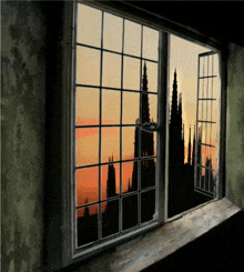 a window with a view of a sunset and a silhouette of a building