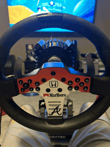 a red and white steering wheel with marlboro written on it