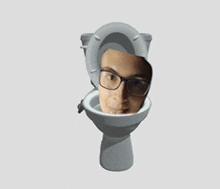 a man wearing glasses is sitting in a toilet bowl