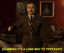 a man in a military uniform is humming it 's a long way to tipperary while holding a stick .