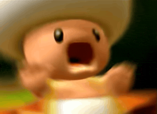 a blurred image of a toad with his mouth wide open