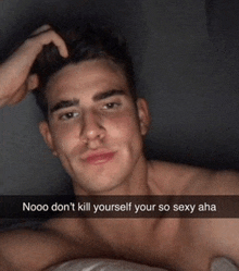 a shirtless man is laying in bed with a caption that says nooo don 't kill yourself your so sexy aha