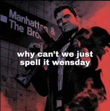 a man holding a gun in front of a manhattan and the bronx sign