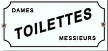 a sign that says dames toilettes messieurs on it .