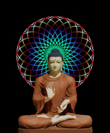 a statue of a buddha is surrounded by a colorful circle with g.m.s written below it