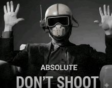 a man wearing a helmet and goggles with the words absolute don 't shoot below him