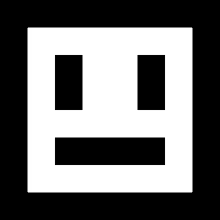 a white square with two black squares on it and a smiley face .