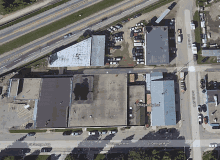 an aerial view of a residential area with a dragonfly inn on the corner