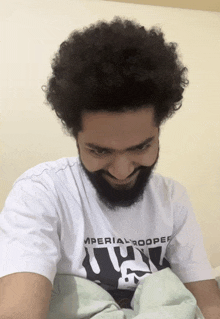 a man with a beard is wearing a white imperial trooper t-shirt