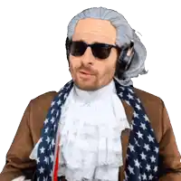 a man wearing a wig and sunglasses is wearing an american flag scarf around his neck
