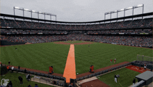 an empty baseball stadium with an orange carpet and a sign that says lpc