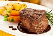 a white plate with a steak and vegetables on it