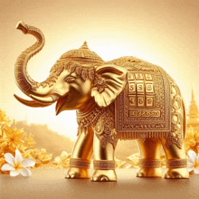 a golden elephant statue with the number 472520 on its back