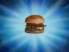 a hamburger with lettuce , tomato , cheese , and a bun on a blue background .