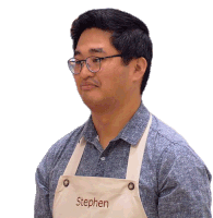 a man with glasses and an apron that says stephen