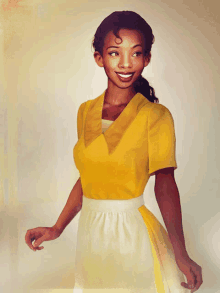 a woman in a yellow top and white apron