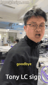 a man in a black jacket says goodbye to tony lc sign